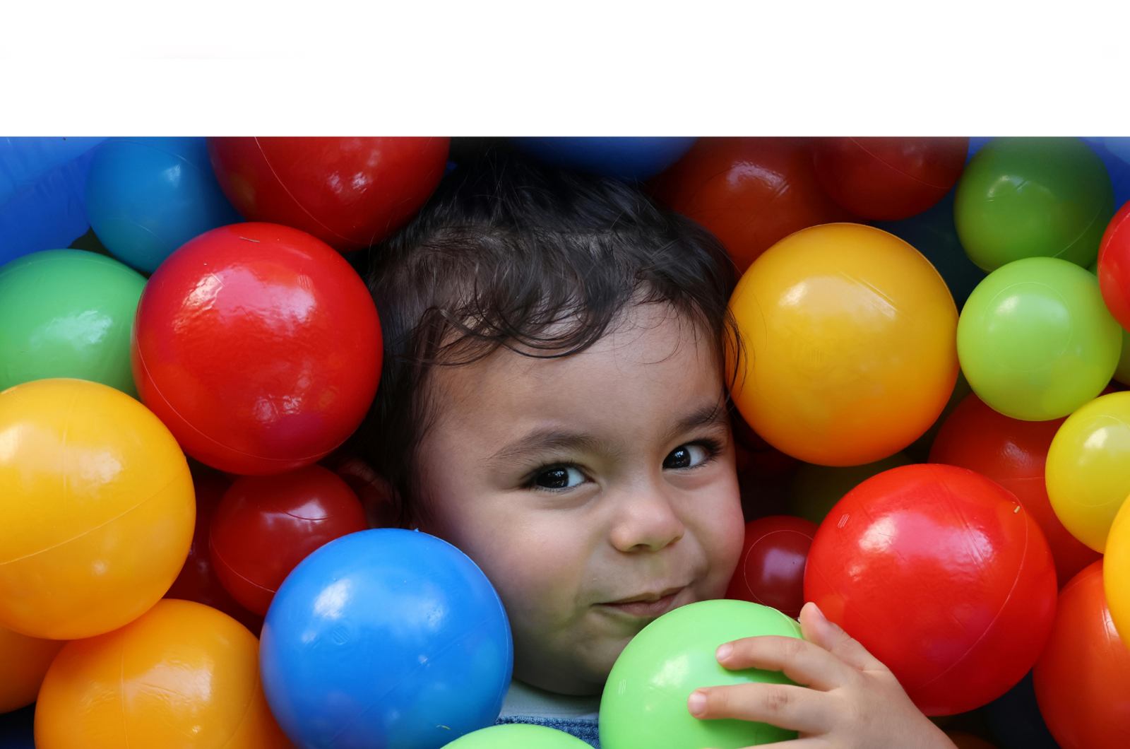 child in ballpit